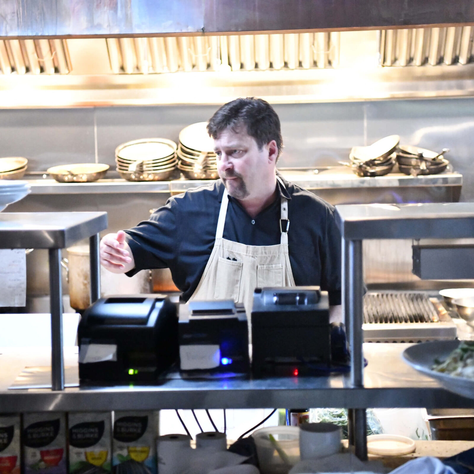 Chef Trevor Jones preparing a fresh meal in the kitchen of his West Kelowna restaurant, The Landing